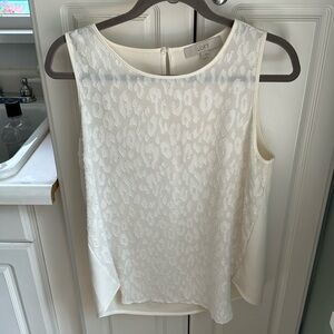 Cream colored blouse; raised leopard pattern, smoke free home; dry cleaned